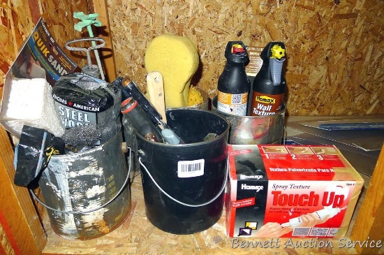 Assortment of putty knives, steel wool, sponges, Homax wall texture spray, Homax spray texture