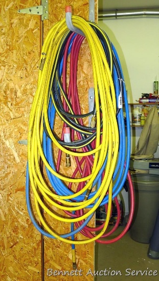 4 Sections of air hose of various lengths, approx 25' to 50'.