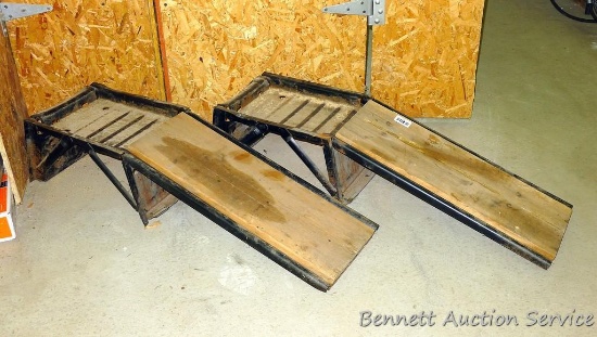 Pair of steel automobile ramps are 38" x 10" x 12" tall and have wooden ramp covers.