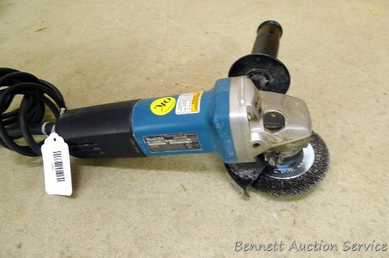 Makita 4-1/2" angle grinder, model 9557NB, runs.