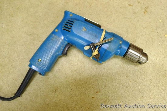 Makita 3/8" reversible drill, model 6403, runs.