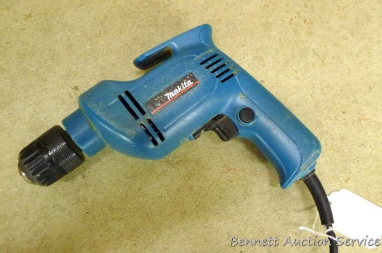 Makita 3/8" reversible drill, model 6406, runs.