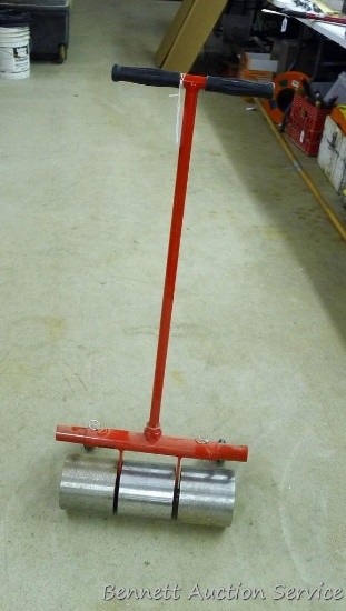 Linoleum roller is 18" x 39" tall and appears hardly used.