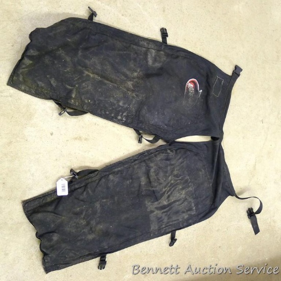 Aosaftey logger's chaps appear complete with some wear.