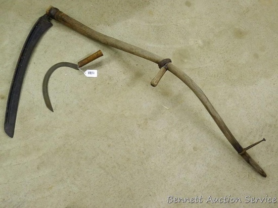 Hay scythes with 27" blade missing hand knob and hand sickle.