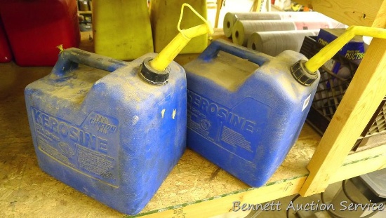 Two 5-1/4 gallon kerosene totes with spouts.