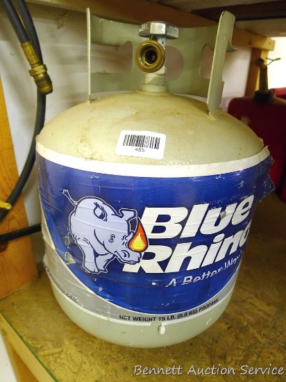 Partially full propane tank with hose, torch and lighter.