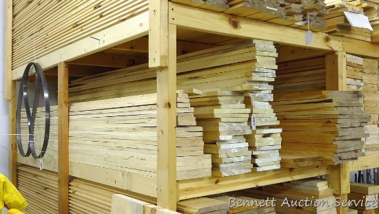 12" pine boards over 8' long; popple or basswood boards up to 7" x 8'; left hand stack is believed