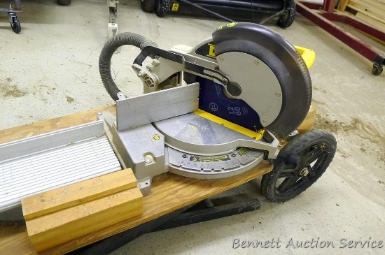 DeWalt 12" miter saw, part DW704, comes with a rolling miter saw stand and extra blade,