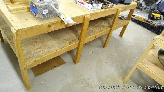 Sturdy homemade shop table with lower shelf, framed with 2x4 lumber is 97" x 48" x 35". Please come
