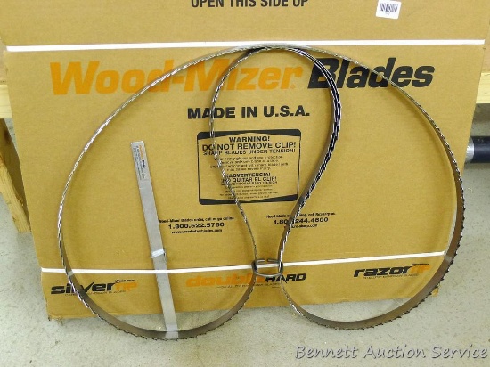 Three Wood-Mizer sawmill blades .042 x 1-1/4" x 144" NIB.  Plus a blade guide alignment tool.
