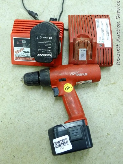 Milwaukee reversible 3/8" driver/drill with 2 batteries and 2 chargers. Runs.