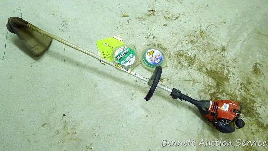 Homelite Z825sd weed trimmer with 2 partial rolls .080 string. Runs.