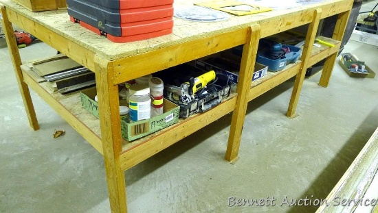 Heavy duty work table with lower shelf framed with 2x4 lumber is 48" x 98" x 34-1/2".