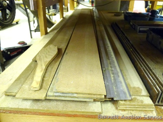 Four 1/8" x 40" angle iron; aluminum cutting guide is 97" long; variety of 1/8" & 1/4" board