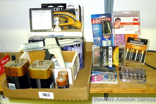 Conney lens cleaning station; 3M disposable earplugs; Epoxy dispenser with extra tubes of epoxy;