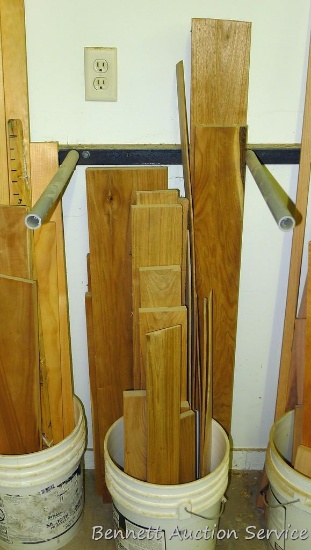 Bucket of lumber pieces, largest is 5" x 51", butternut or similar.