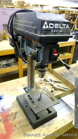 Delta 8" drill press model 11-950 is 23-1/2" tall with 6-1/2" work plate. Has 1/4 HP motor. Runs.