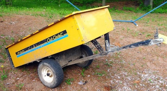 Cub Cadet 17 cu ft dumping yard trailer.