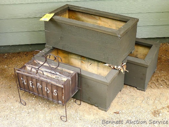 Three planter boxes, plus a magazine rack-turned-herb planter.