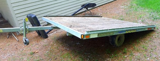 Caravan galvanized steel frame snowmobile trailer. Bed is 100" x 122". Tires are in fair shape. Has