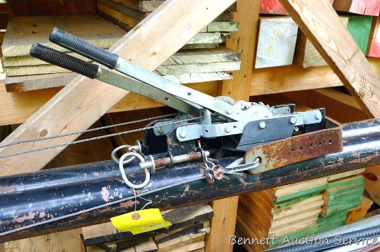 Two jacks for raising wall section, bottom plate screws to deck. Nice design, built sturdy.