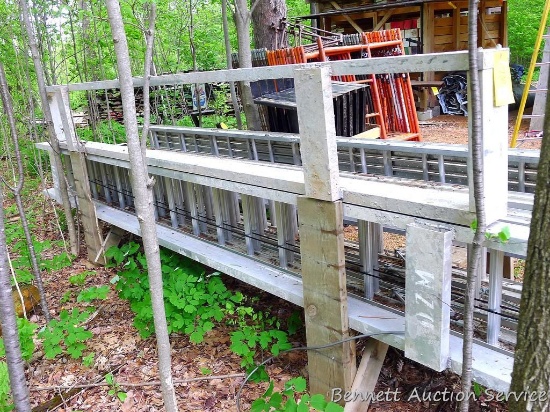 Two aluminum concrete screeds.