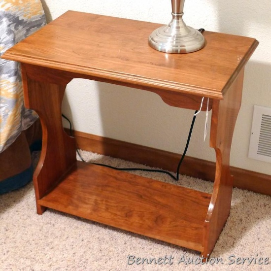 Solid wood end table is sturdy and in good condition. Measures 2' x 15" x 23" high.
