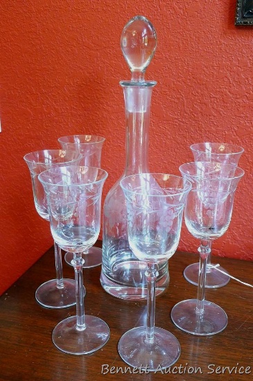 Pretty decanter with glass stopper and six wine glasses have a matching cut grape and leaf design.