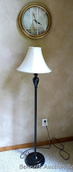 Wall clock depicts the Eiffel Tower, approx. 15" diameter; 57" tall floor lamp. Both work.