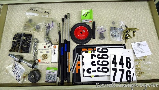 Contents of drawer includes adhesive numbers/letters, grease fittings, ball joint ends, plow bolts,