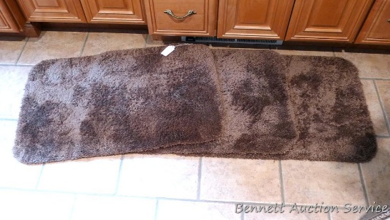 Three nice rubber backed bath rugs are all soft and in good shape. Each is 21" x 34".