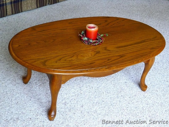 Nice solid wood coffee table is 45" x 27" x 17". Comes with candle and ring. Table is in very good