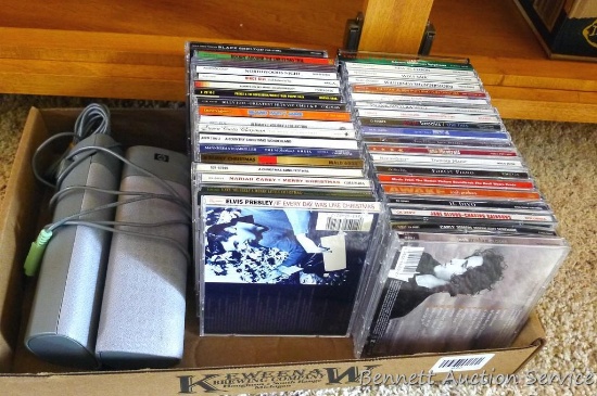 CDs including Elvis Presley, Mariah Carey, Josh Groban, Garth Brooks, nature sounds, Vince Gill and