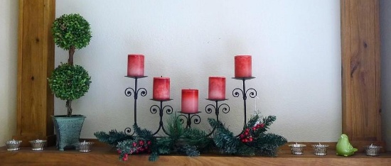 Mantle decorations including 2' tall faux topiary, 24" wide candle display and greenery, votive