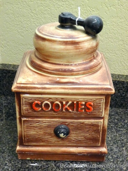 Vintage McCoy coffee grinder cookie jar shows crazing inside. Stands 10" to top of lid. A few minor
