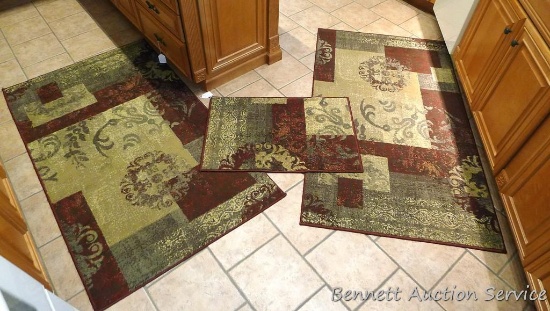 Three area rugs. Two largest are approx. 3' x 5-1/2', smaller is 22" x 33".
