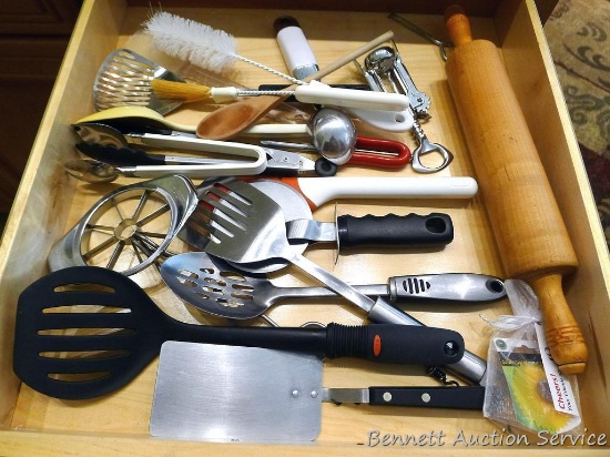 Kitchen utensils including KitchenAid ice cream scoop; tongs, turners, pizza cutter, maple rolling