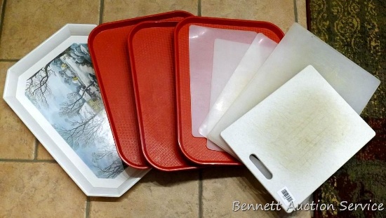 Two heavy duty plastic cutting boards, plus a variety of trays.
