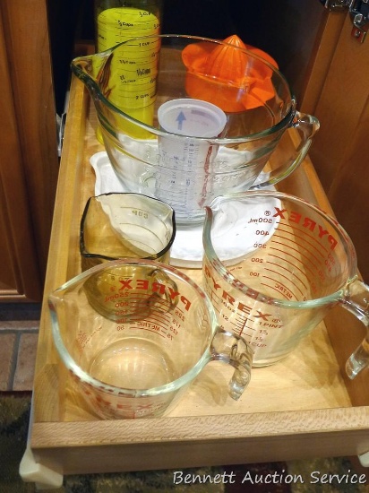 Two quart Pampered Chef batter bowl with lid; Pyrex measure cups, 2 & 4 cup; one cup glass measure;