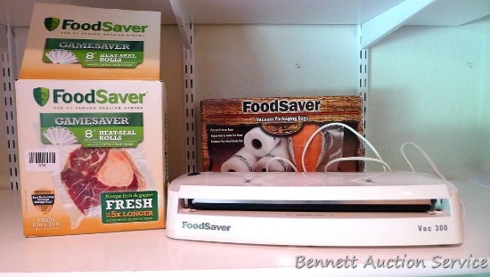 Food Saver Vac 300; FoodSaver Gamesaver 8" heat-seal rolls, five full and one very partial roll.
