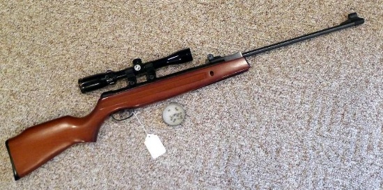 Daisy Model 1000 break action pellet rifle with Bushnell 3x9 scope in Weaver mounts. Cocks and