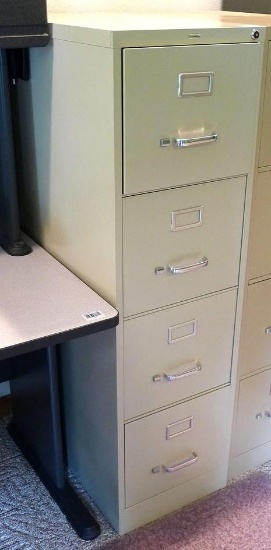 Lockable four drawer file cabinet with key is in good condition. Stands 52" x 15" x 27" deep.