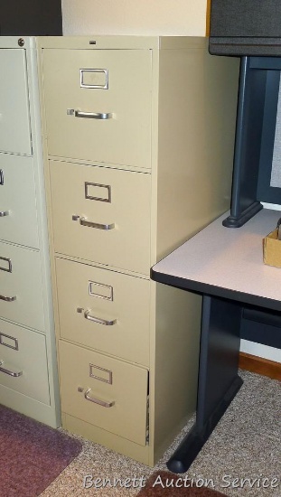 Hon four drawer filing cabinet is in good condition. Measures approx. 52" x 15" x 27" deep.