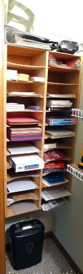Office supplies including copy paper, sticky notes, dictionaries, paper shredder, Sony alarm clock,