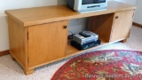 Nice newer style entertainment stand with storage. Piece is in good condition, measures 7' wide x