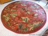 8' diameter Wilshire area rug matches lot 1004. Rug is in very good condition, pretty pattern.