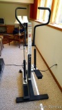 Precor 731e stepper machine works well, has adjustable tension. Stands 5'2