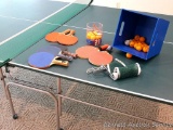 Ping pong table with accessories including paddles, extra net, ping pong balls. Table measures 5' x