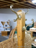 Hardwood coat or hall tree stands approx. 5-1/2' tall, half of one hook is broken; also large woven